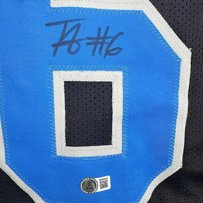 Framed autographed Terrion Arnold Detroit Lions blue number 8 jersey patch