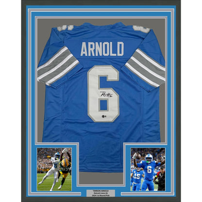 Framed autographed Terrion Arnold Detroit Lions blue jersey back, name Arnold number 6, Beckett BAS COA