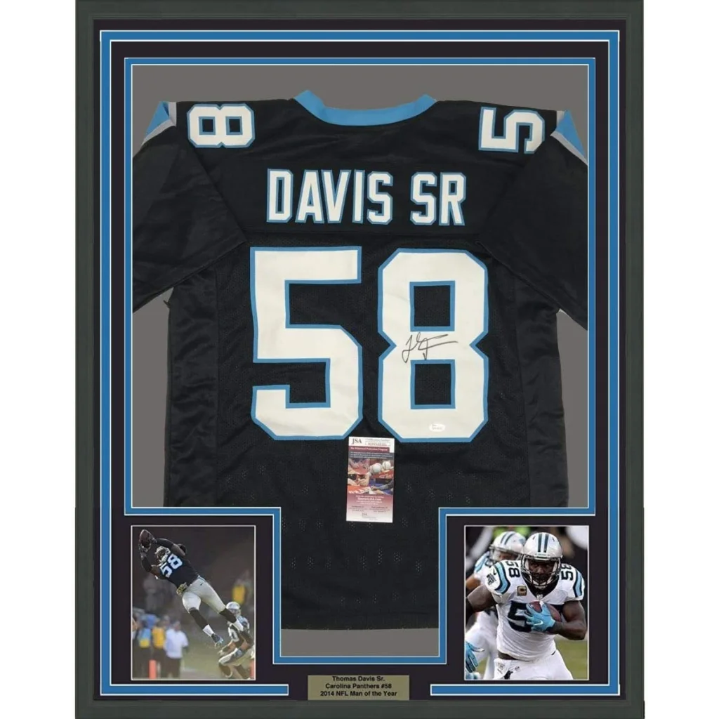 Back side of a black carolina panthers football jersey with light blue trim signed by thomas davis sr number 58 framed