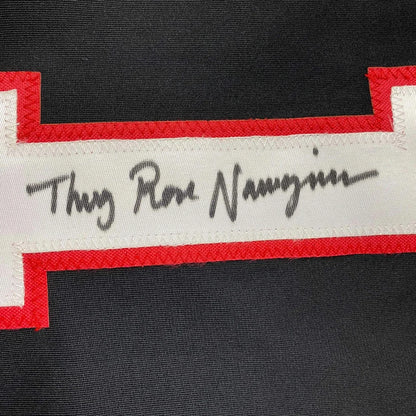 Black fabric with red-trimmed white strip and handwritten signature from Thug Rose Namajunas professionally framed jersey
