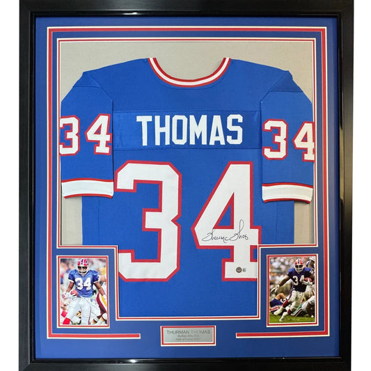 Framed Thurman Thomas autographed Buffalo Bills jersey with player photos for your man cave