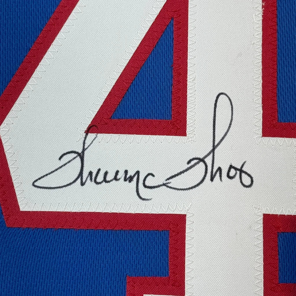 Autographed blue and white Buffalo Bills jersey with red trim perfect for your man cave