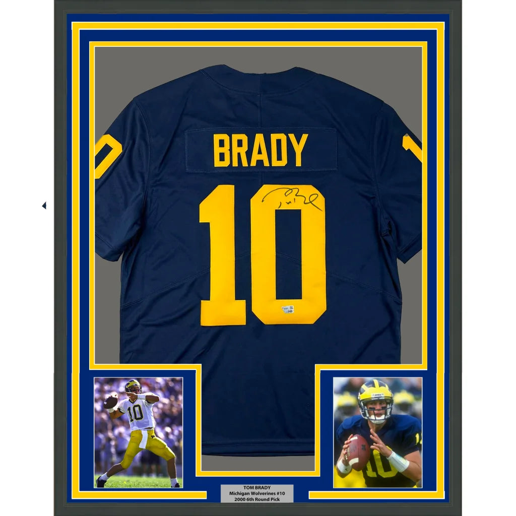 Framed Tom Brady Michigan Wolverines autographed jersey with two photos on display