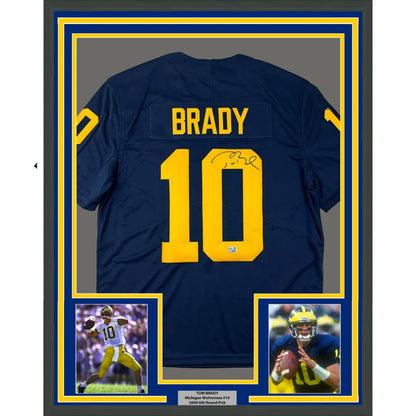Framed Tom Brady Michigan Wolverines autographed jersey with two photos on display