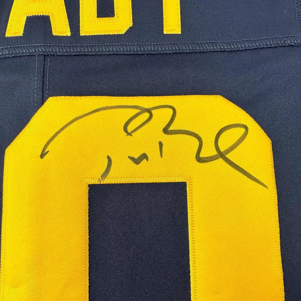 Framed autographed Tom Brady Michigan Wolverines navy blue jersey with yellow accents and signed number 10