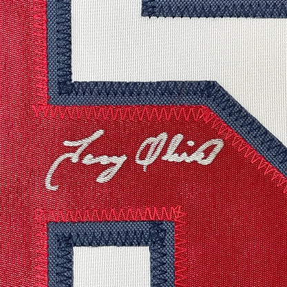 Framed autographed Tony Oliva Minnesota white baseball jersey with red and white embroidery, navy trim, and Jay Ohio script, Beckett BAS COA