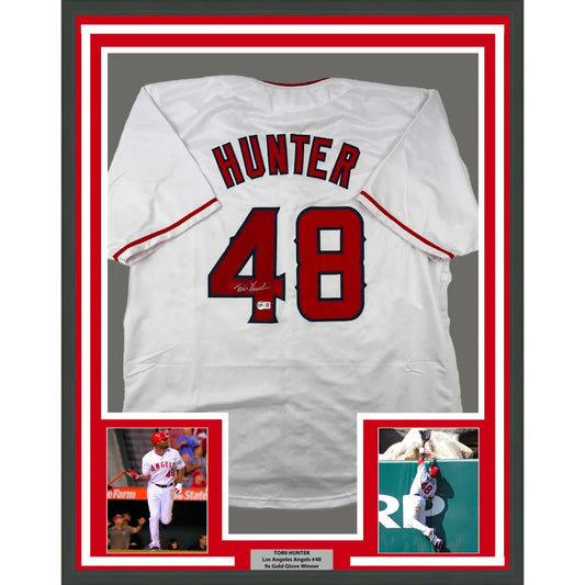 Framed signed Los Angeles Angels Torii Hunter #48 jersey with commemorative photos
