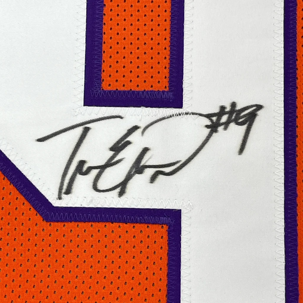 Framed autographed Travis Etienne Jr. orange Clemson jersey with number 19