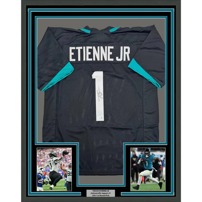 Framed signed Travis Etienne Jr. black Jaguars jersey with COA
