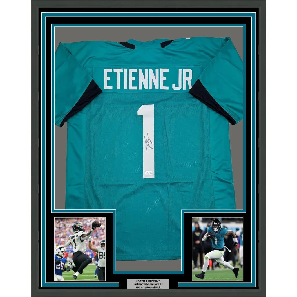 Framed Travis Etienne signed Jacksonville teal jersey with player photos and Beckett BAS COA
