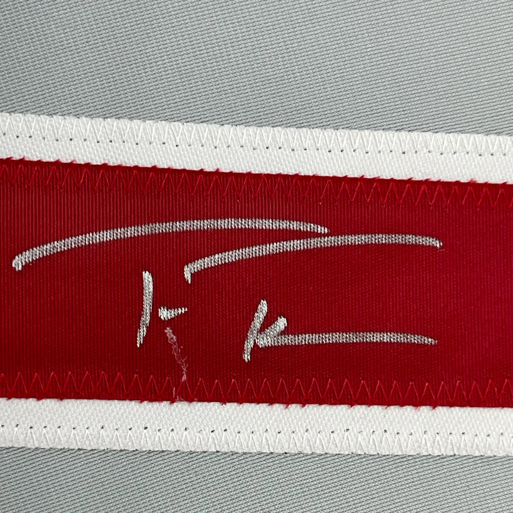 Red woven label with white embroidered Trea Turner signature on framed Philadelphia Phillies jersey