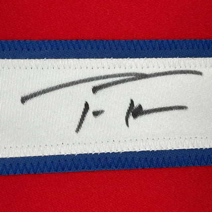 Autographed white fabric tag on a red Championship Ready Framed Baseball Jersey