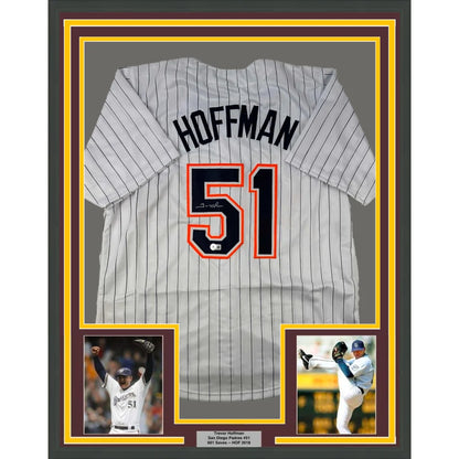 Framed Trevor Hoffman autographed Padres jersey with two small photos