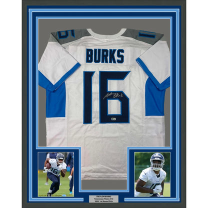 Autographed Tennessee Titans jersey with Burks name and number 16, plus player photos
