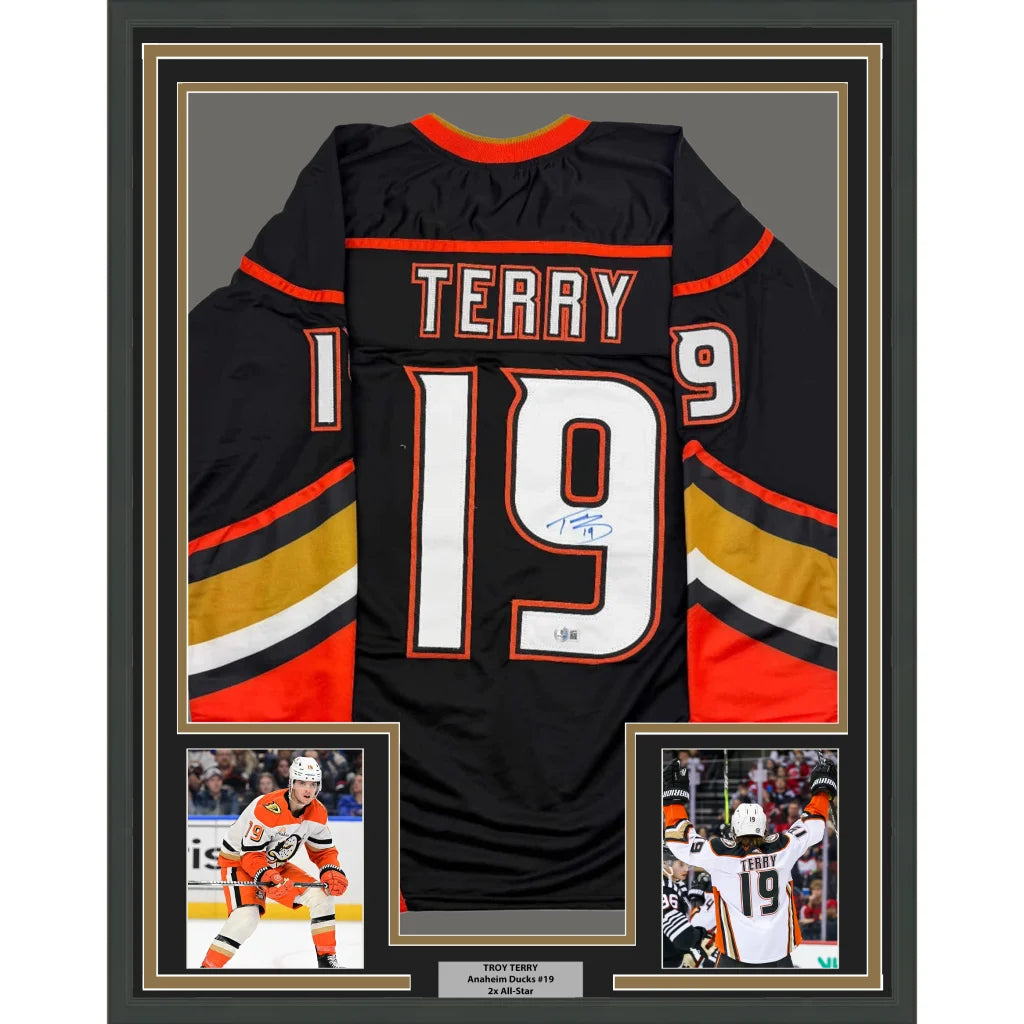 Framed Troy Terry autographed Anaheim Ducks jersey with player photos ready to hang