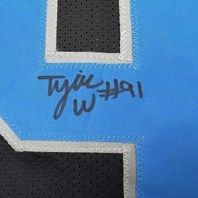 Framed Autographed Tyleik Williams 35x39 Detroit Black Football Jersey Beckett BAS COA | Certified Authentic Signed Memorabilia | vintageantiquesgifts.com