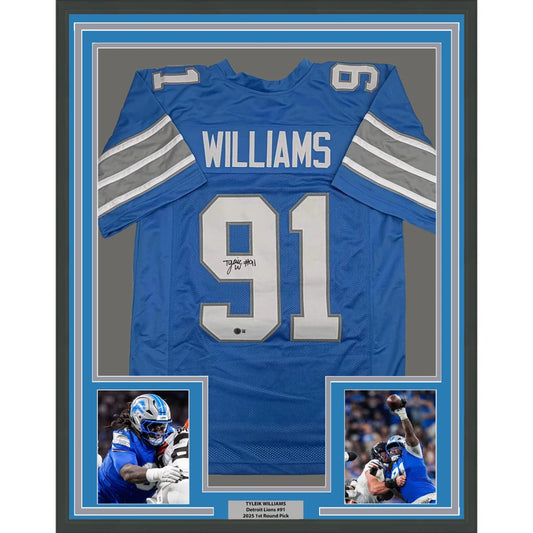 Framed Autographed Tyleik Williams 35x39 Detroit Blue Football Jersey Beckett BAS COA | Hall of Fame Sports Memorabilia | vintageantiquesgifts.com