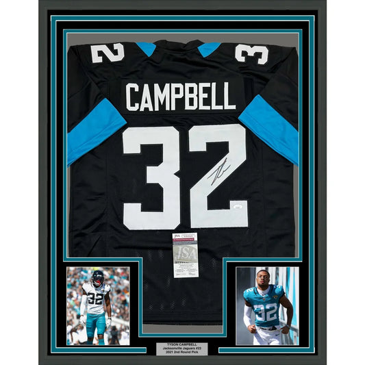 Framed autographed black Football Jersey with teal accents, player photos, and authentication
