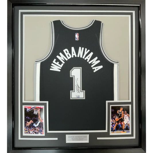 Framed Victor Wembanyama signed Spurs jersey with two action shots on display