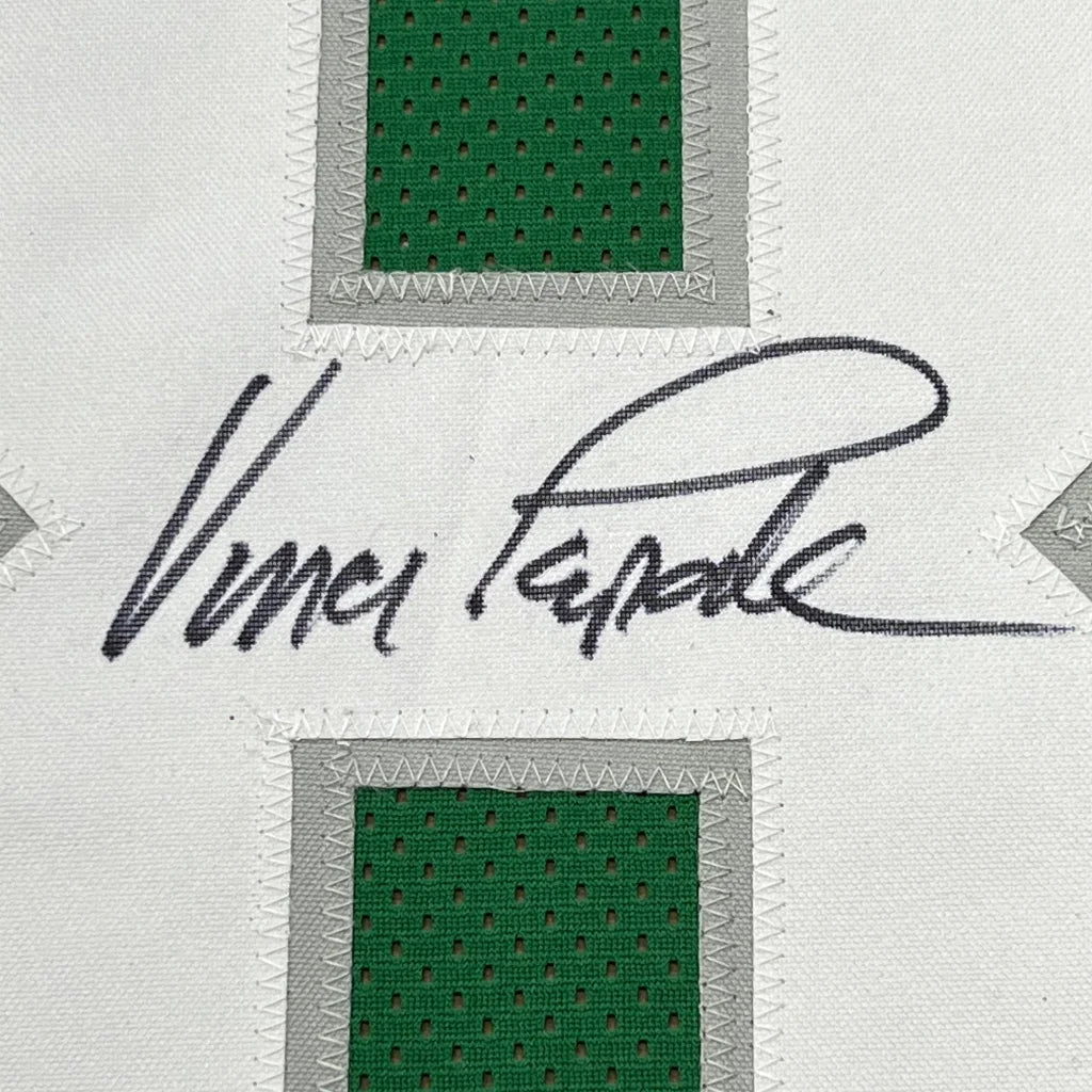 Green perforated mesh jersey swatch with gray borders and Vince Papale signature