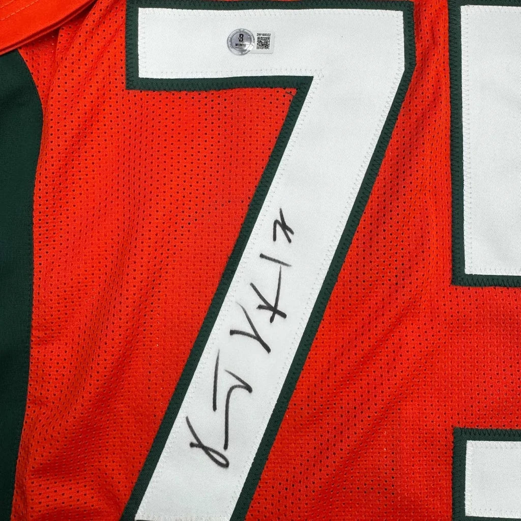 Framed autographed Vince Wilfork orange Miami jersey back with #7, Beckett COA