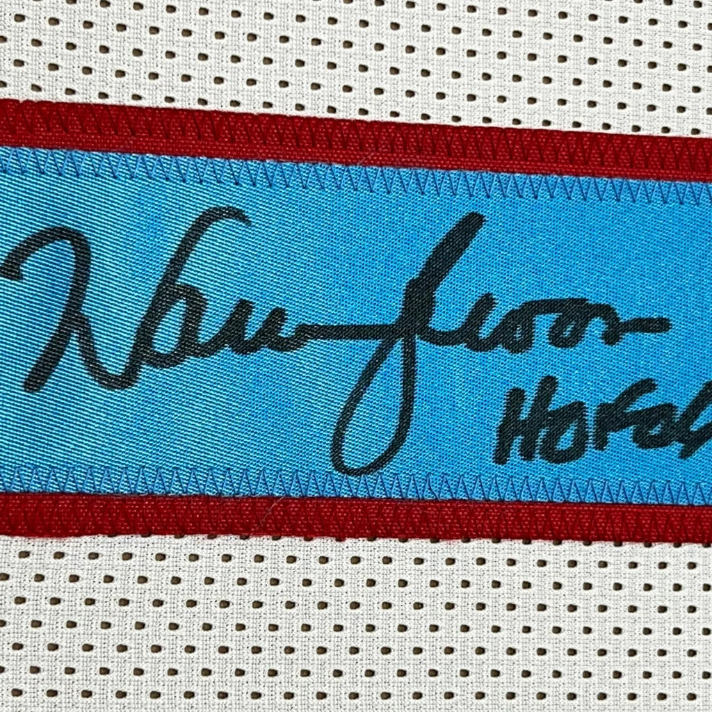 Vibrant blue Warren Moon HOF 06 jersey label on white perforated fabric