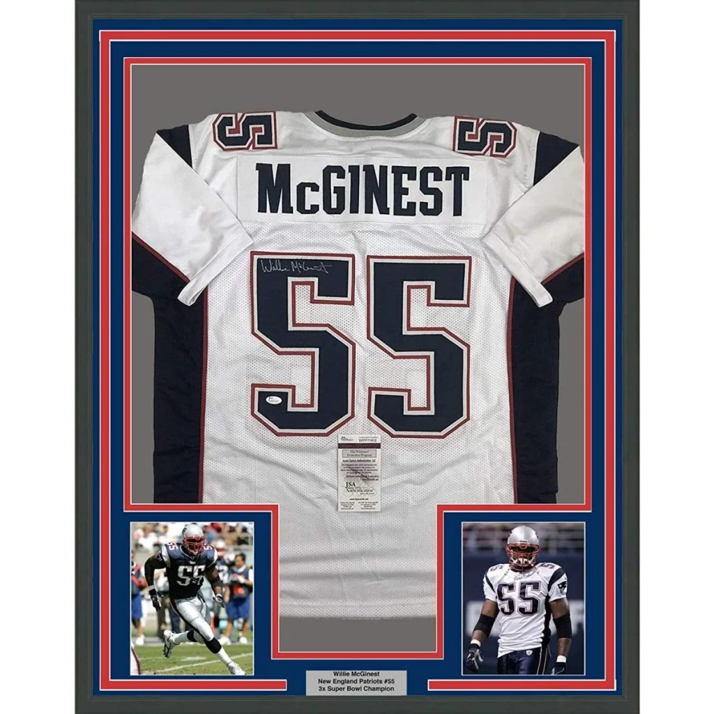 Professionally framed Willie McGinest Patriots jersey collectible with autographs and display photos