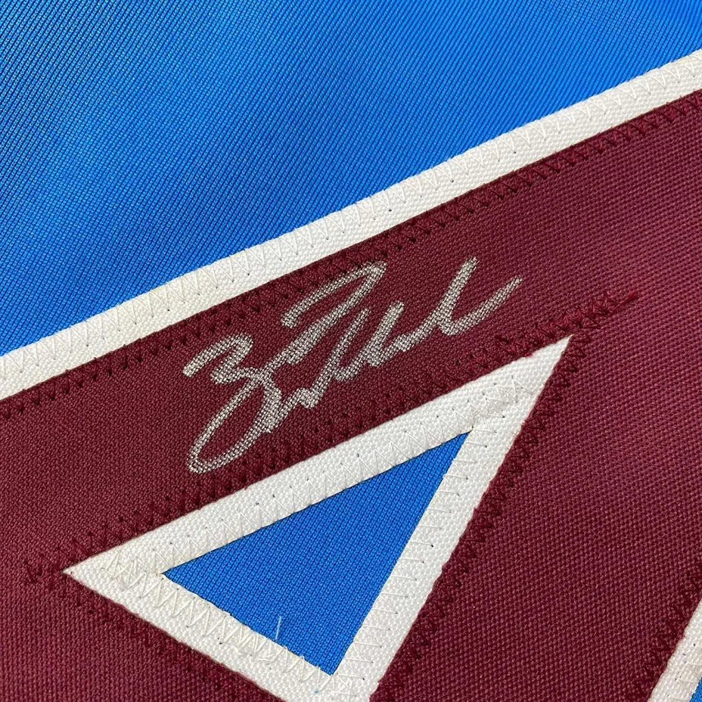 Autographed blue and maroon Phillies jersey with white trim ready for display