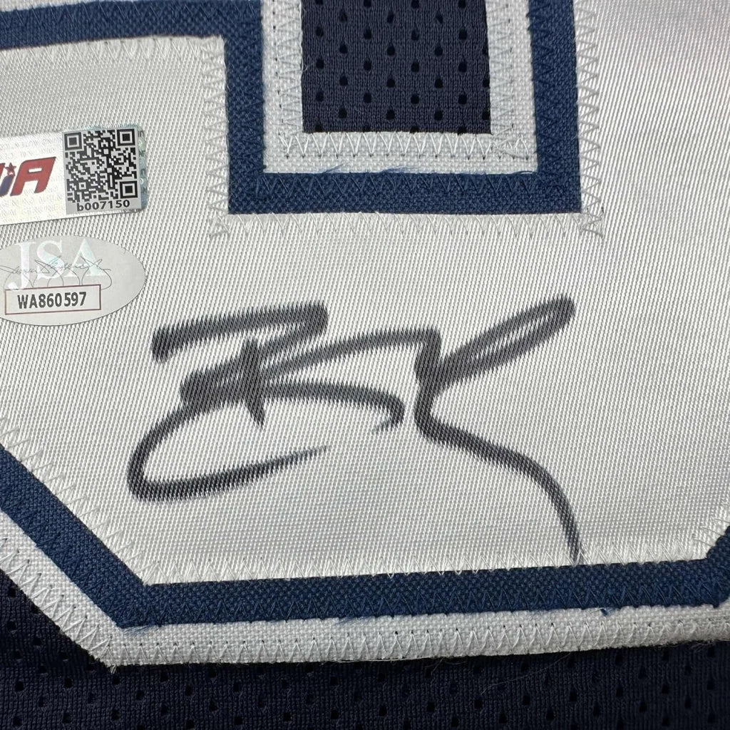 Autographed Dallas Cowboys Jersey with authentication stickers ready to hang