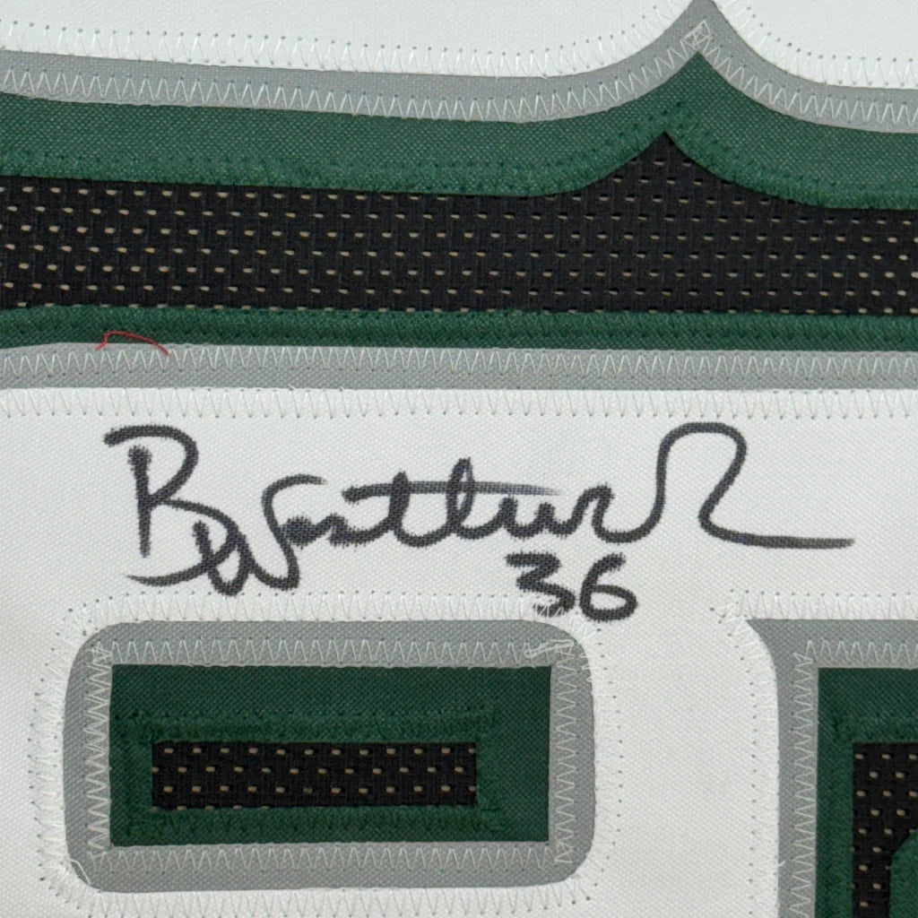 Autographed Eagles jersey with number 36, framed and ready to hang with action photos