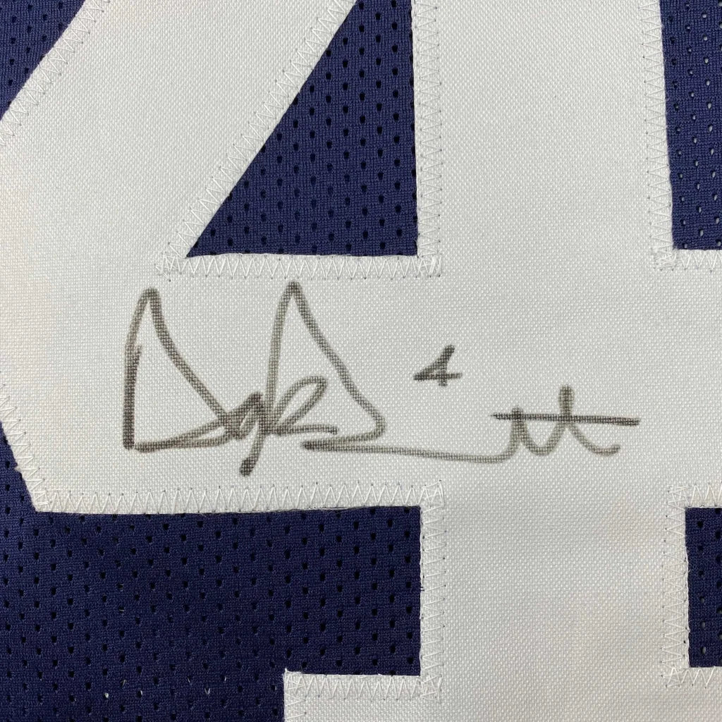 Autographed dark blue Dallas Cowboys jersey with white numbers and Dak Prescott signature