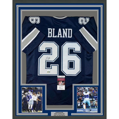 Framed Dallas Cowboys Bland #26 jersey with action photos and plaque ready to hang