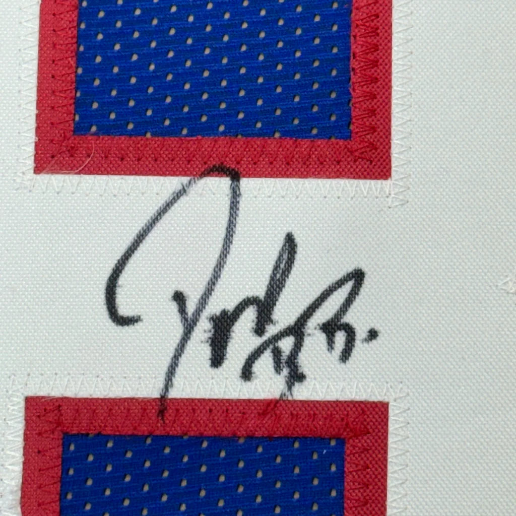 Autographed Buffalo Bills jersey fabric from Don Beebe framed with photos