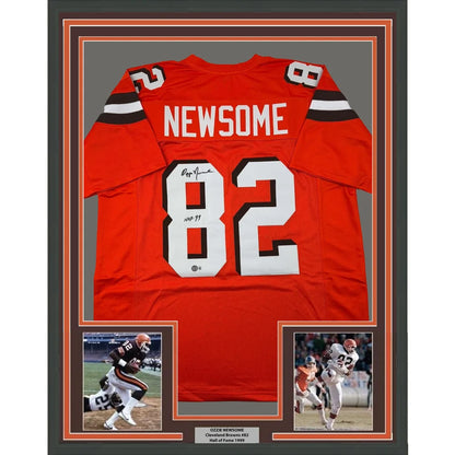 Orange football jersey with white lettering and numbers in a black frame for your Man Cave