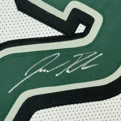 Autographed Jason Kelce Eagles jersey with photos in a frame for display