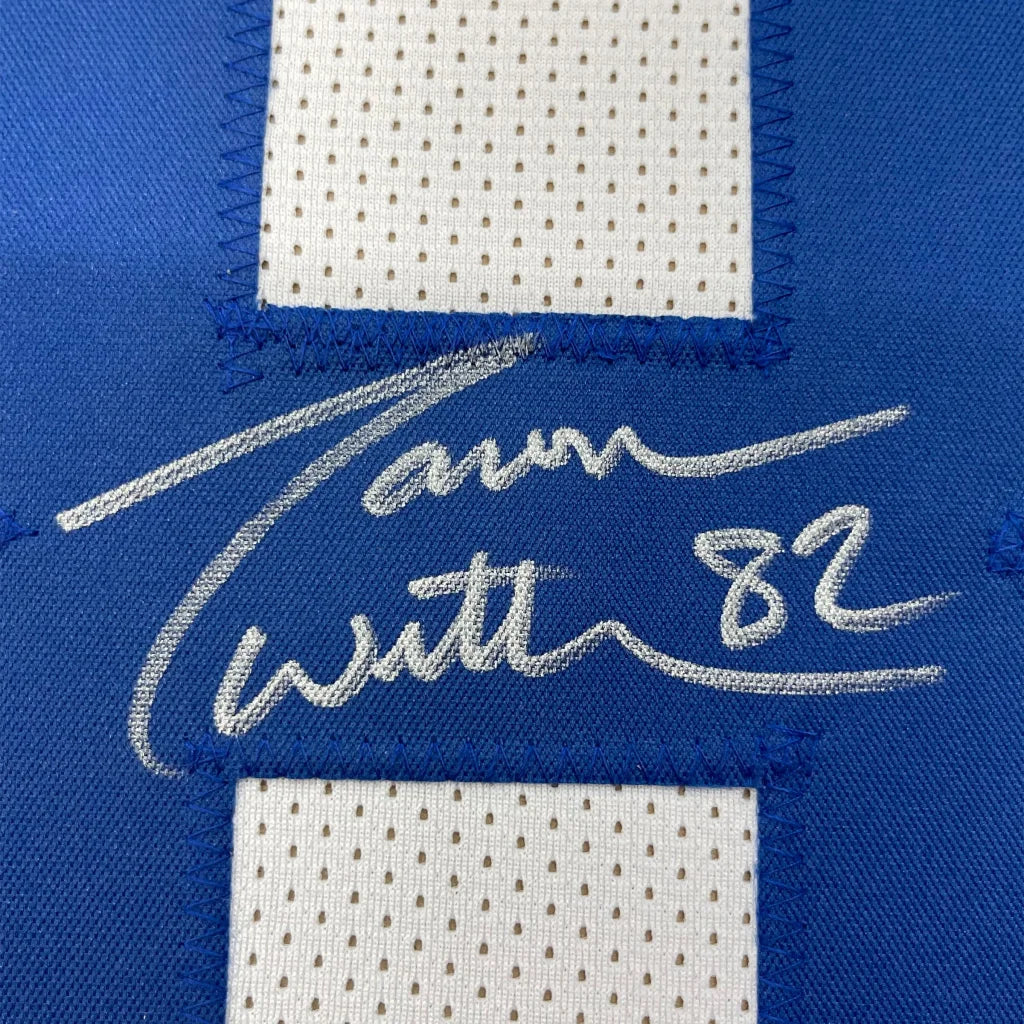 Blue and white Jason Witten Cowboys jersey with silver autograph and framed photos