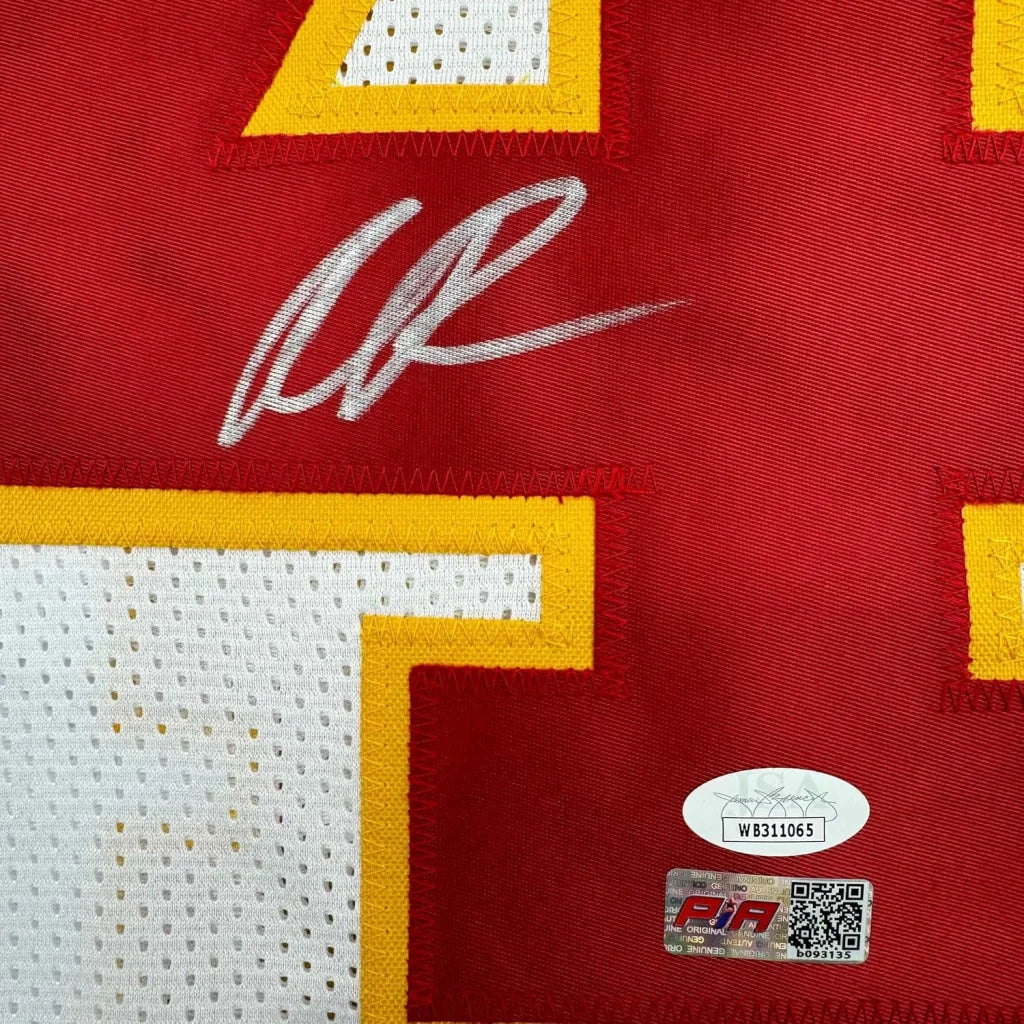 Red Kansas City Chiefs jersey with white autograph and authentication stickers