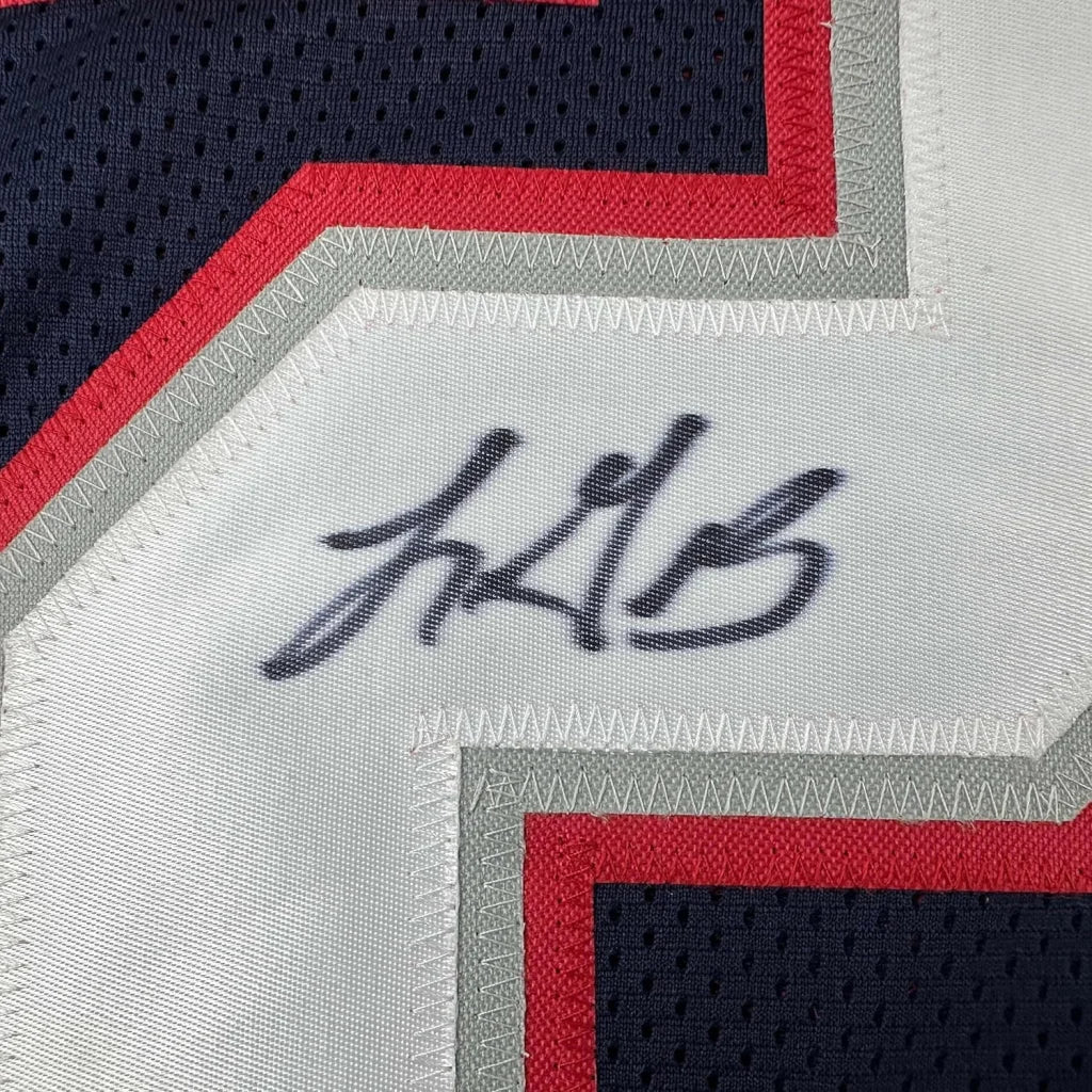 Framed LeGarrette Blount signed Patriots jersey with black ink on white mesh