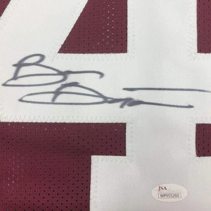 Framed maroon football jersey with white accents, autograph and photos