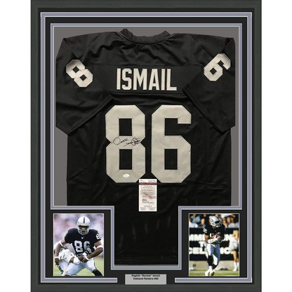 Framed black NFL jersey with autographs and player photos perfect for your man cave