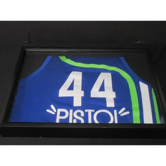 Framed Pete Maravich basketball jersey with number 44 in green and blue colors