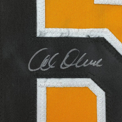 Black and orange sports jersey with white autograph, perfect for hanging decor