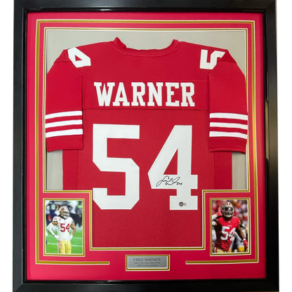 Framed Fred Warner signed red football jersey with photos