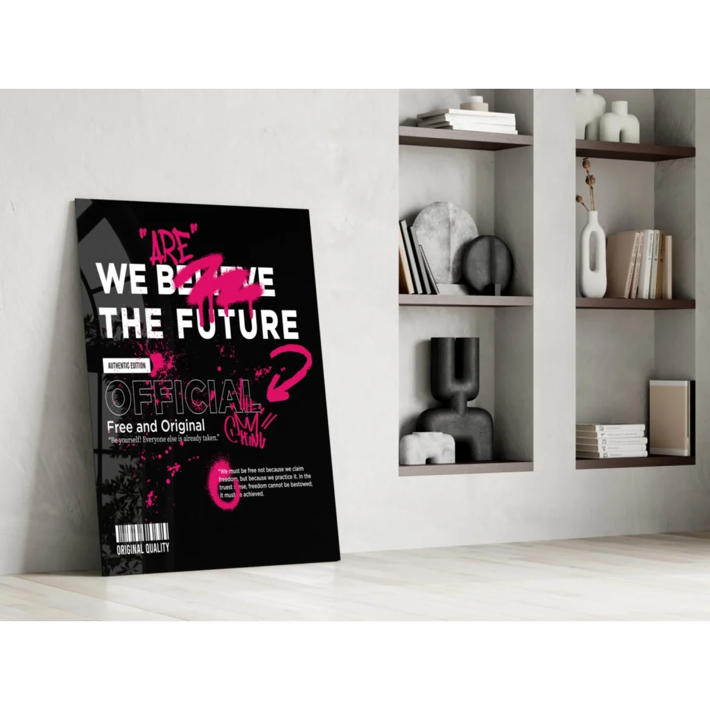 Stunning glass wall art poster: Black with bold white and pink We Believe the Future text and stylized pink graphic on minimalist wall