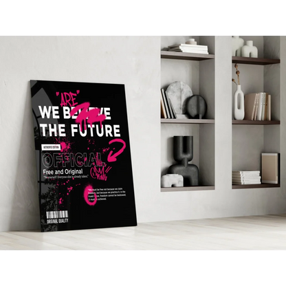 Stunning glass wall art poster: Black with bold white and pink We Believe the Future text and stylized pink graphic on minimalist wall