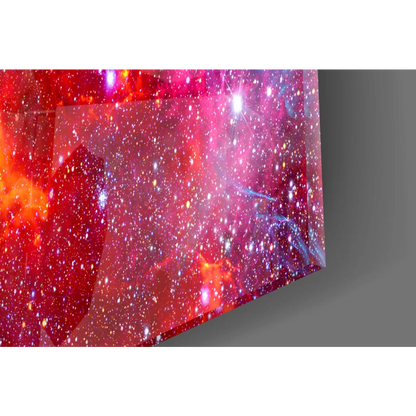 Vibrant red pink cosmic nebula glass wall art with sparkling stars