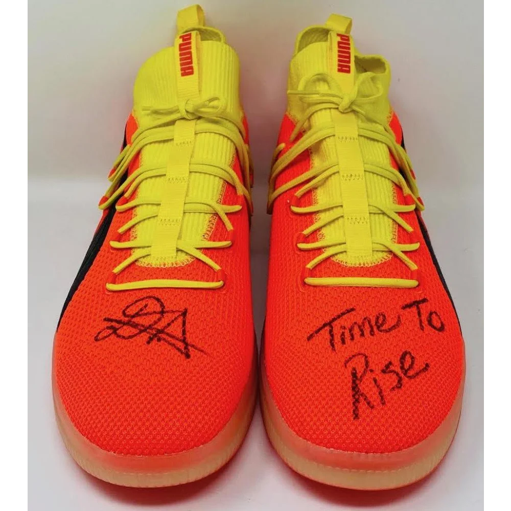 Vibrant orange and yellow Puma sneakers from Game Day Legends collection with black accents