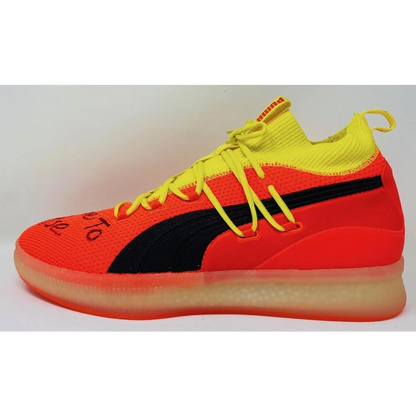 Vibrant orange and yellow Puma Clyde basketball shoe from Game Day Legends collection
