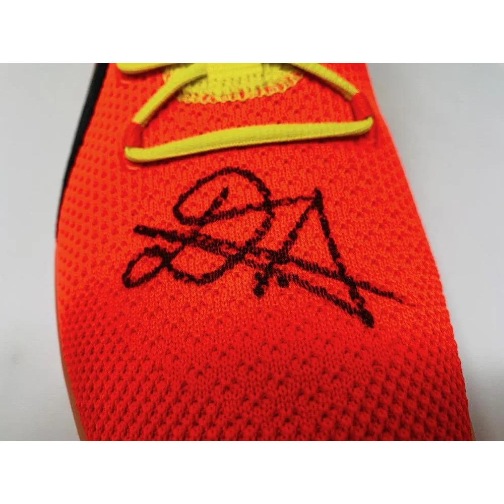 Orange knit athletic shoe with yellow laces from Game Day Legends Deandre Ayton signed Puma Clyde