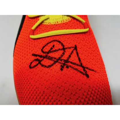 Orange knit athletic shoe with yellow laces from Game Day Legends Deandre Ayton signed Puma Clyde